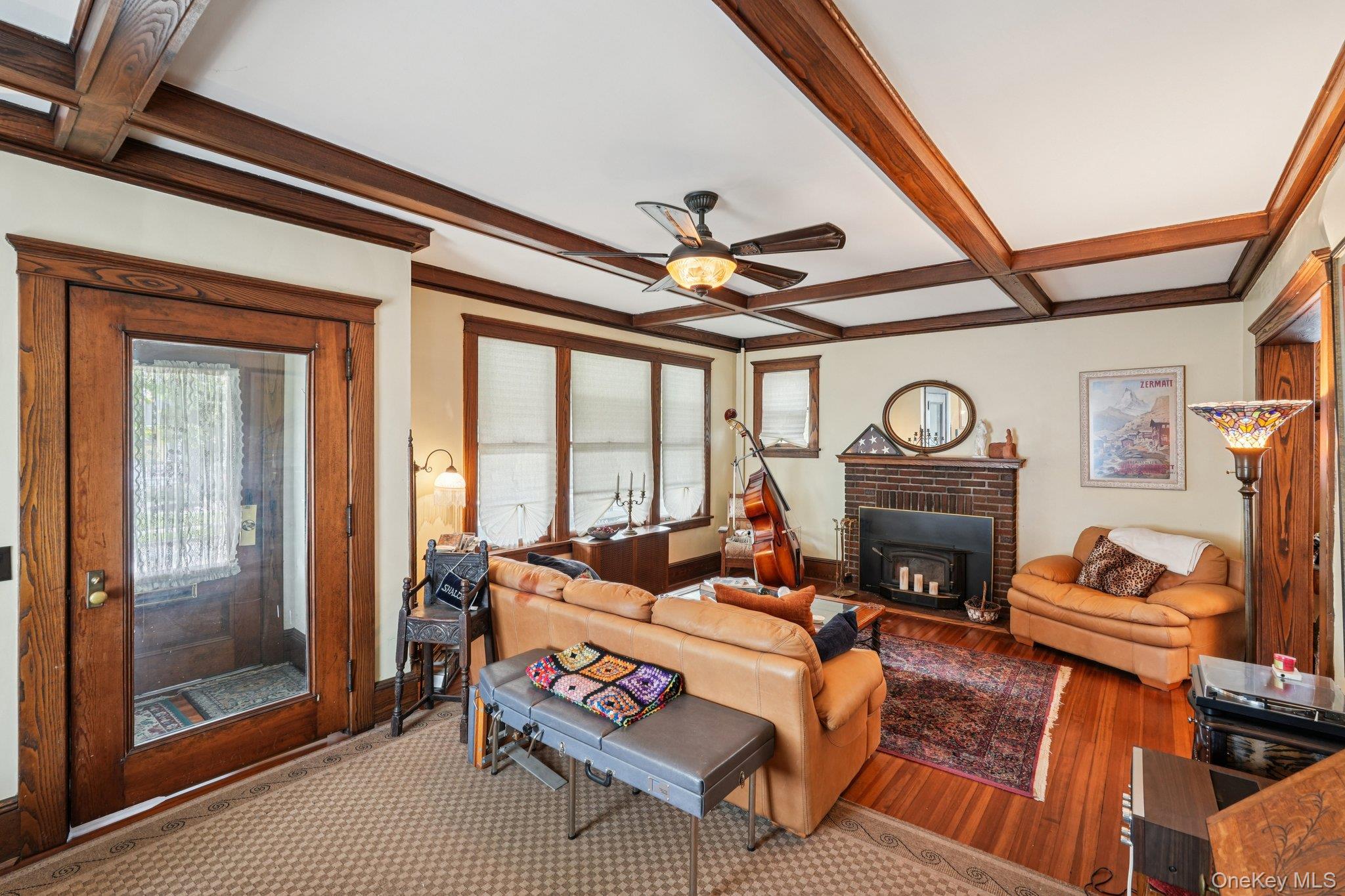 74 East Maple Avenue Suffern, NY 10901 - Photo 6 of 50 Living area with beamed ceiling, coffered ceiling, healthy amount of natural light, ceiling fan, and wood finished floors