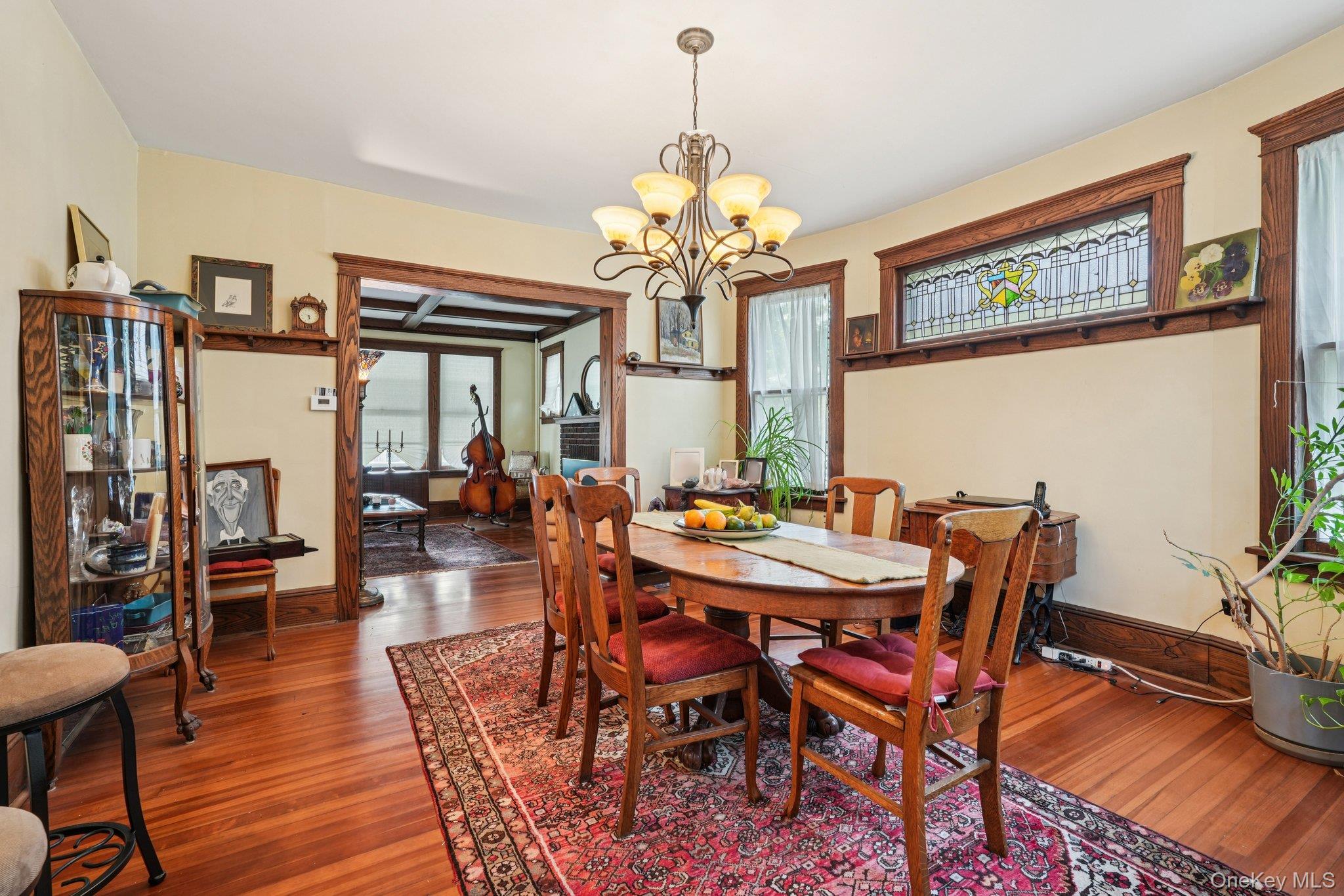 74 East Maple Avenue Suffern, NY 10901 - Photo 10 of 50 Dining room featuring a chandelier and wood finished floors