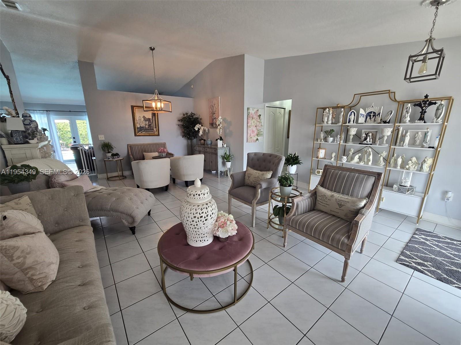 15201 Southwest 177th Terrace Miami, FL 33187 - Photo 12 of 49 a living room with furniture and a rug