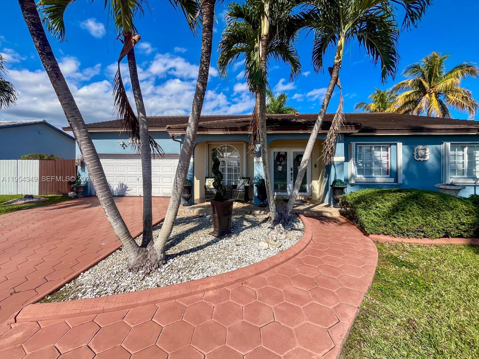 15201 Southwest 177th Terrace Miami, FL 33187 - Photo 2 of 49 a view of a backyard with a patio
