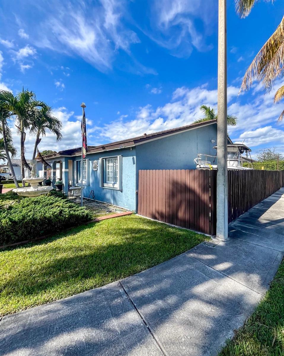15201 Southwest 177th Terrace Miami, FL 33187 - Photo 3 of 49 a view of a house with a yard
