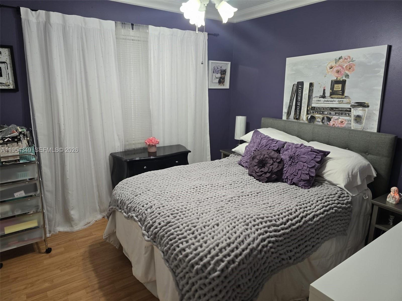 15201 Southwest 177th Terrace Miami, FL 33187 - Photo 39 of 49 a bedroom with a bed and a window