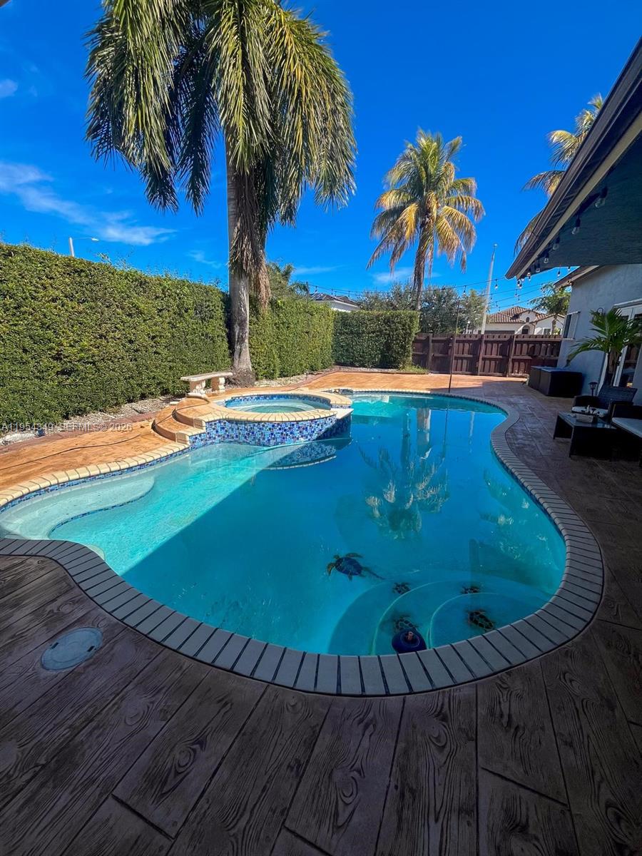 15201 Southwest 177th Terrace Miami, FL 33187 - Photo 45 of 49 a view of a swimming pool with an outdoor space