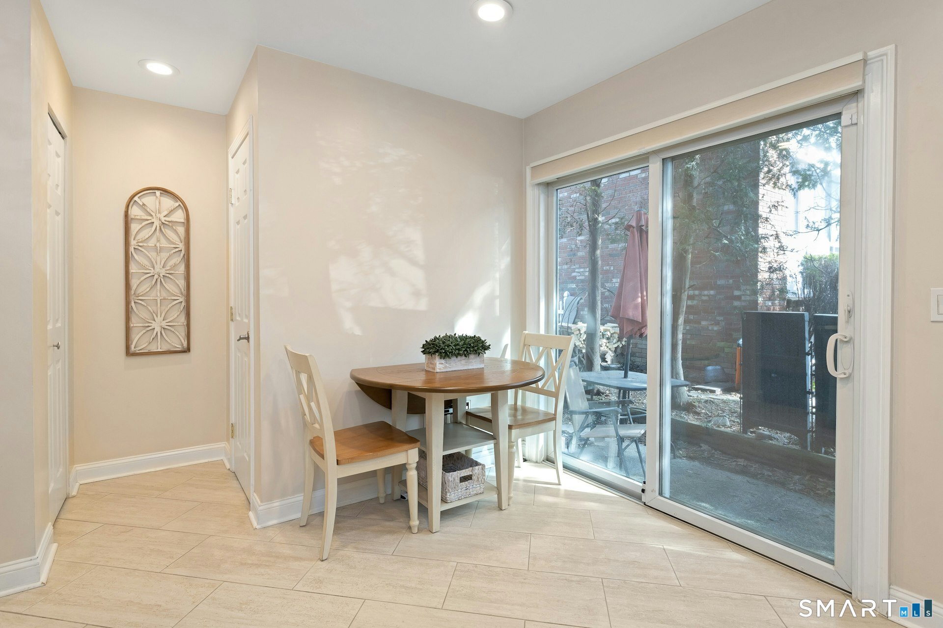 30 Maple Tree Avenue, Unit B Stamford, CT 06906 - Photo 12 of 27 Sliders to patio right off the kitchen