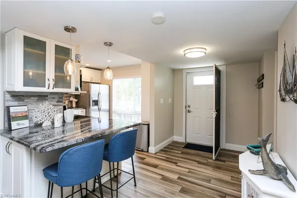 a bedroom with furniture and a flat screen tv