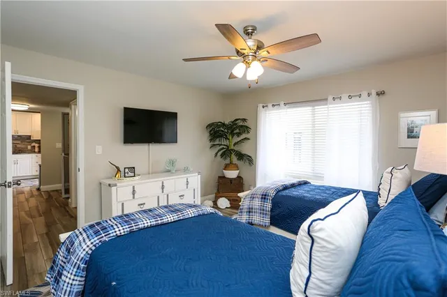 a white toilet sitting next to a shower curtain