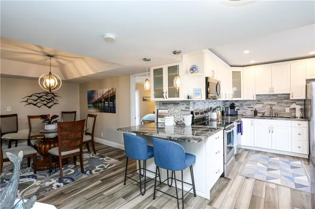 a bathroom with a double vanity sink and mirror