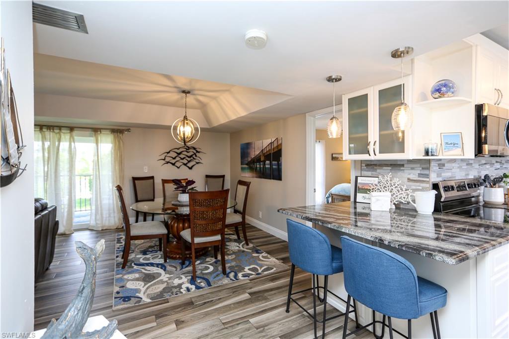 195 Peppermint Lane, Unit 884 Naples, FL 34112 - Photo 30 of 50 a dining room with furniture and window