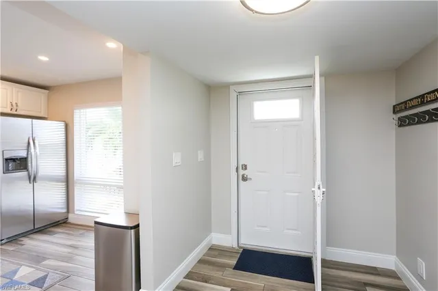 a kitchen with stainless steel appliances granite countertop a stove microwave and refrigerator