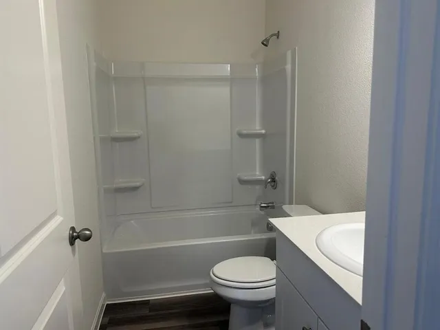 a bathroom with a sink a toilet and a bathtub