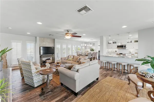 a living room with fireplace furniture and a flat screen tv