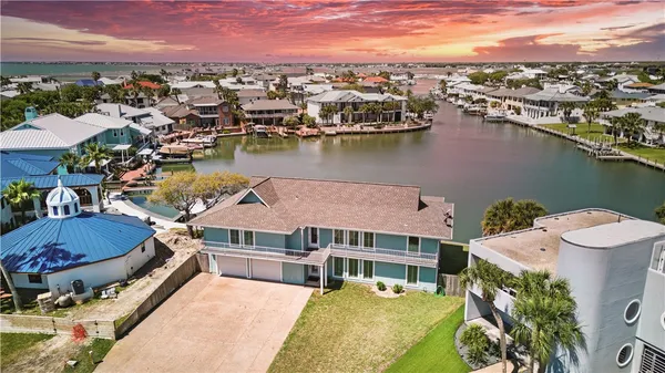 an aerial view of a house with outdoor space