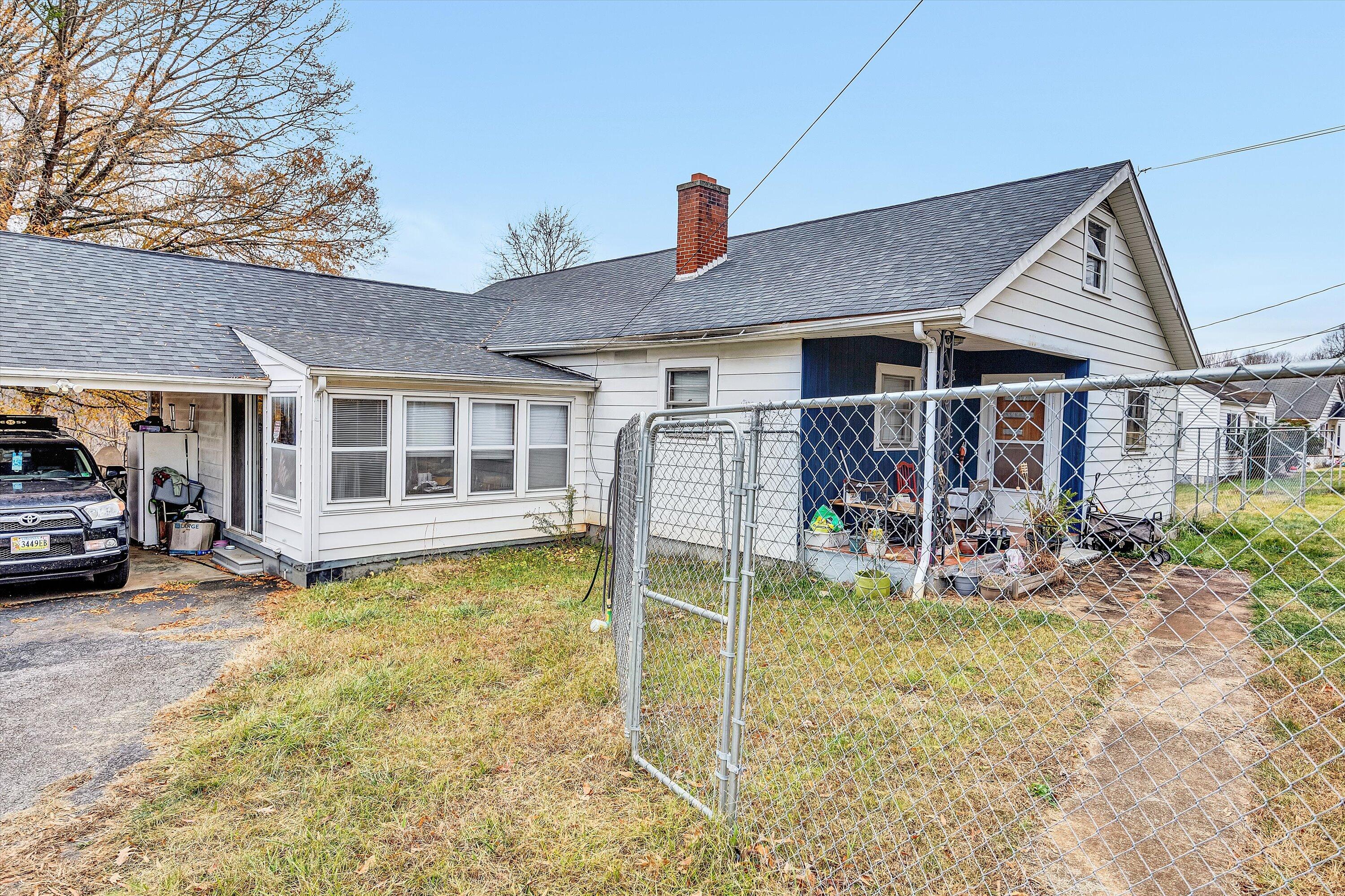 1414 Daniels Creek Road Collinsville, VA 24078 - Photo 17 of 17 a view of a house with a patio and a yard