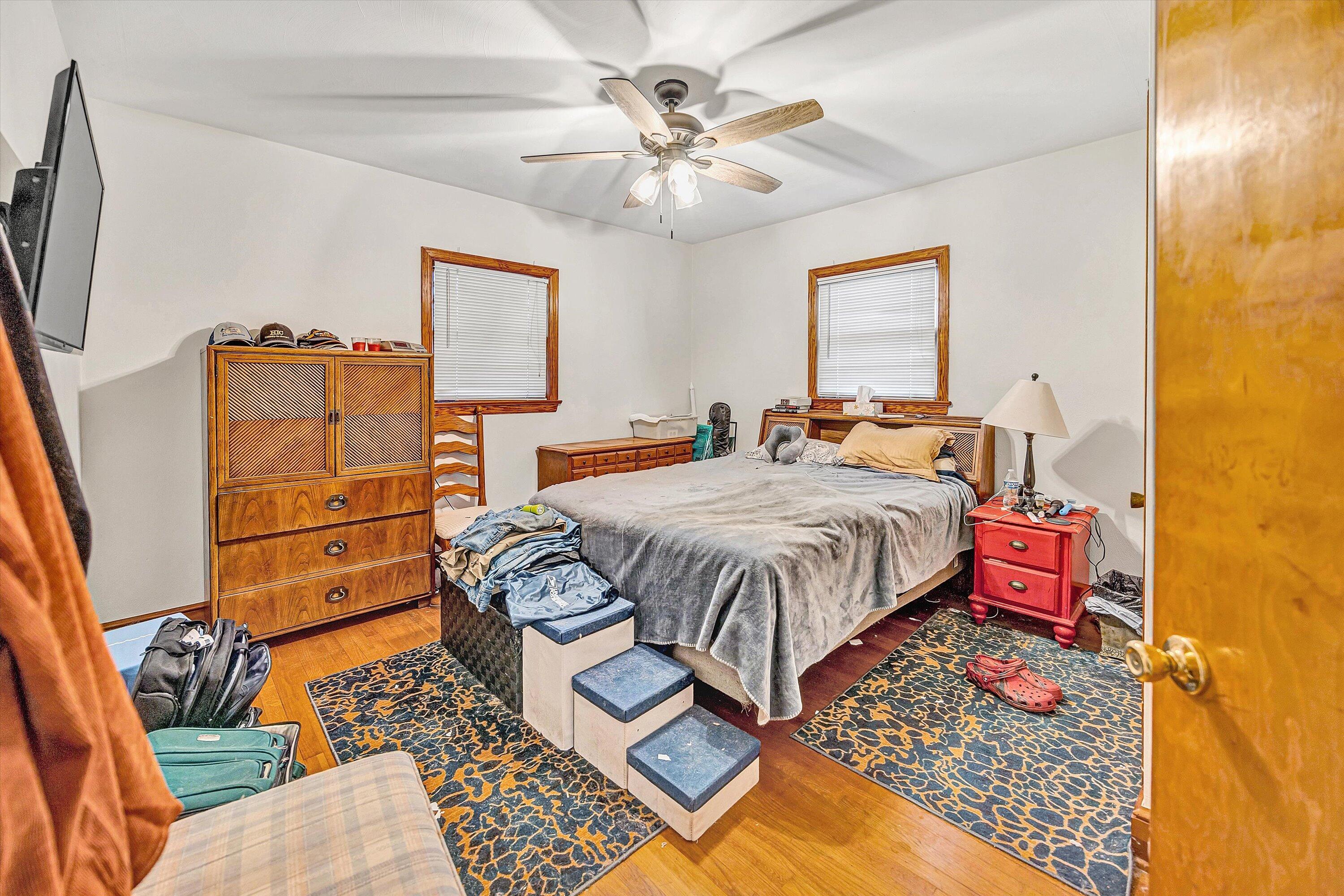1414 Daniels Creek Road Collinsville, VA 24078 - Photo 8 of 17 a bedroom with a bed and wooden floor