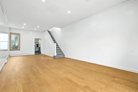 an empty room with stairs and ventilation