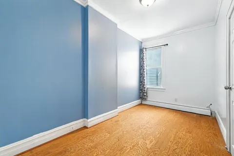 an empty room with a empty space and a window