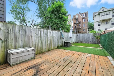 a view of a backyard with wooden floor