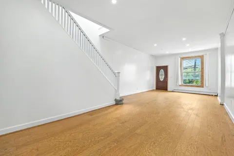 a view of an empty room with a window