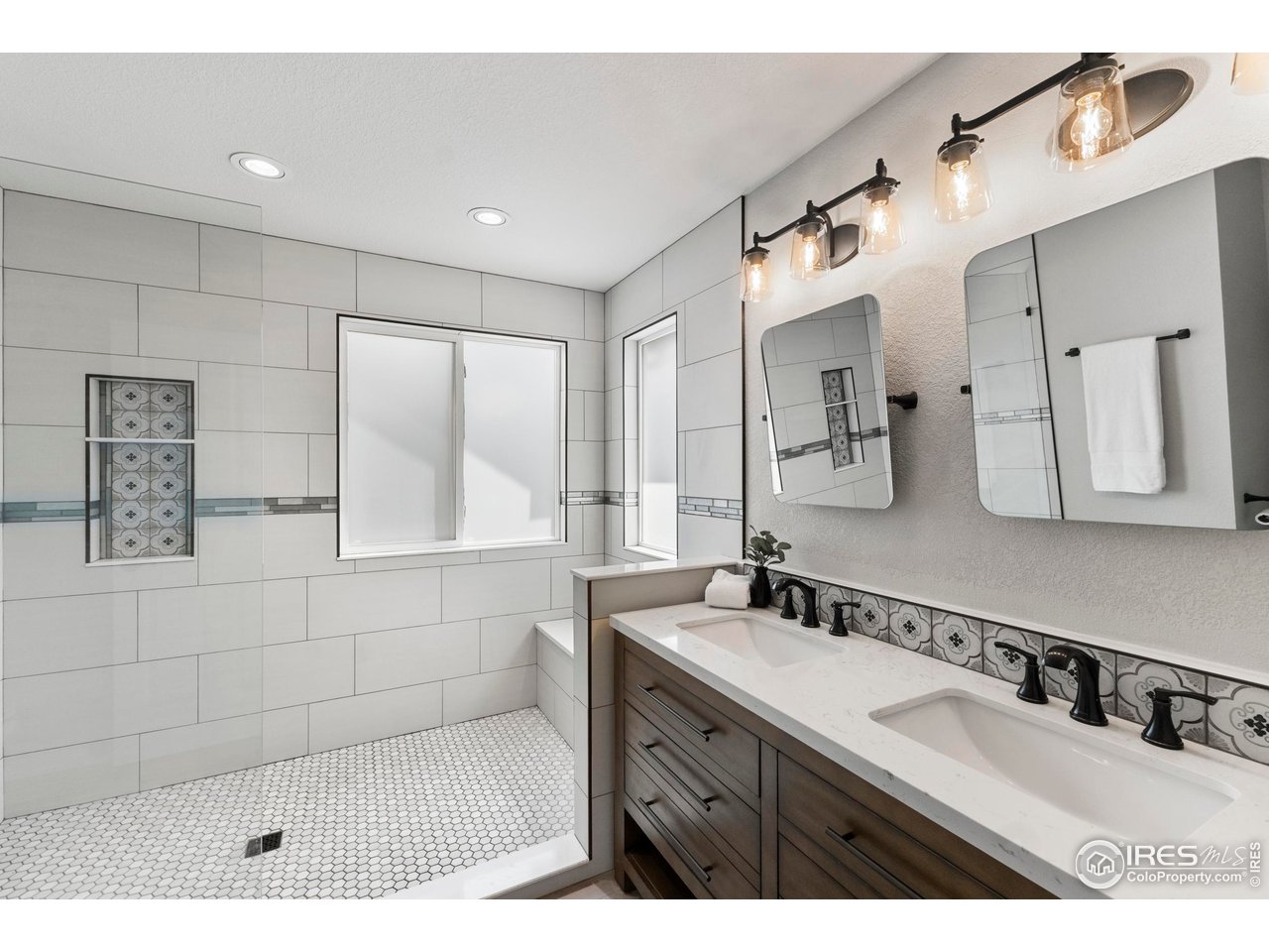 5409 Rabbit Creek Road Fort Collins, CO 80528 - Photo 20 of 40 Primary bathroom fully remodeled with all new, custom tile shower and vanity with double sinks!