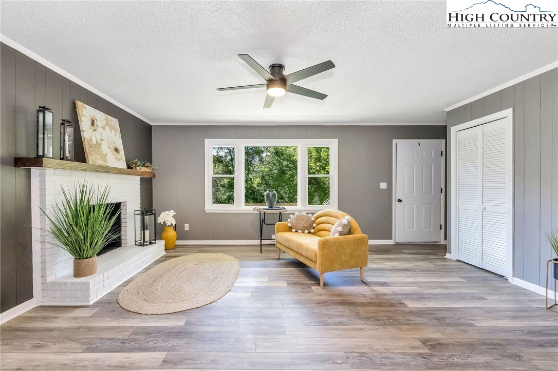 393 Carter Miller Road Todd, NC 28684 - Photo 12 of 50 a living room with a bed furniture and a large window