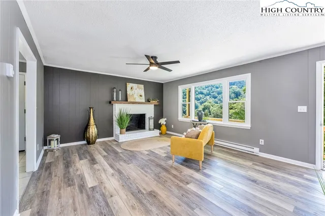 a living room with furniture and a fireplace