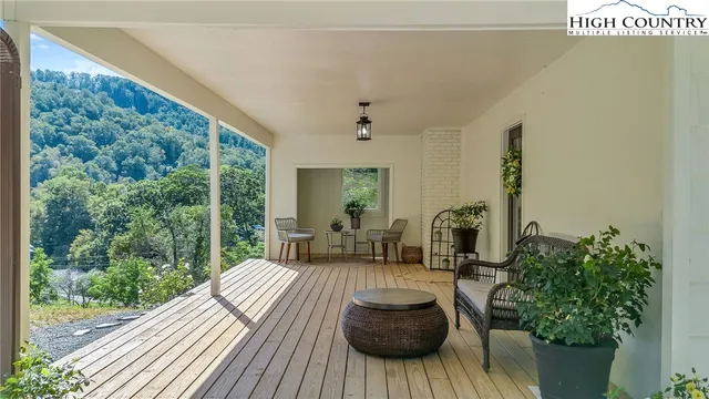 a workspace with wooden floor and windows