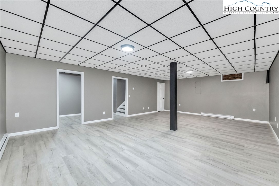 393 Carter Miller Road Todd, NC 28684 - Photo 40 of 50 a view of empty room with wooden floor