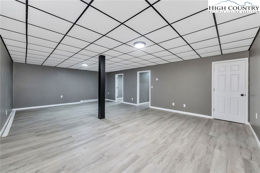 393 Carter Miller Road Todd, NC 28684 - Photo 41 of 50 a view of empty room with wooden floor
