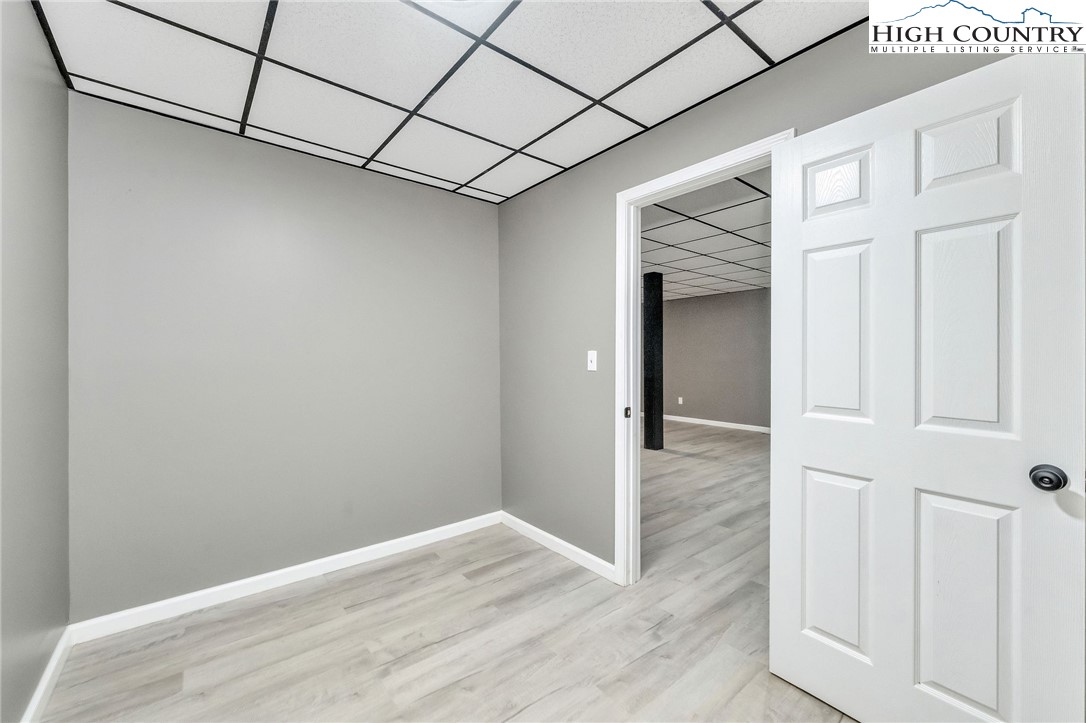 393 Carter Miller Road Todd, NC 28684 - Photo 42 of 50 a view of a hallway with wooden floor