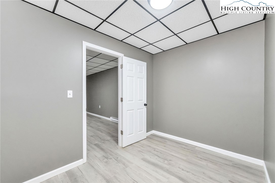 393 Carter Miller Road Todd, NC 28684 - Photo 43 of 50 a view of a hallway with wooden floor