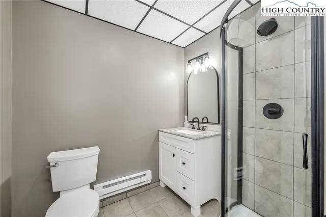 a view of a room with wooden floor and brick walls