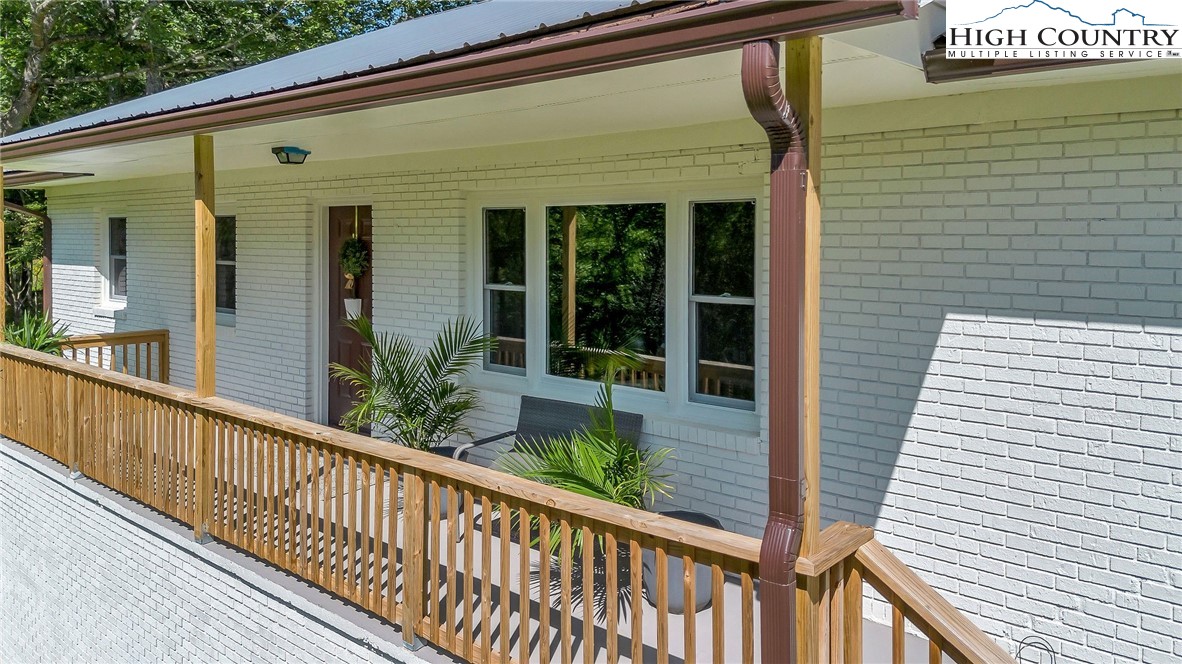 393 Carter Miller Road Todd, NC 28684 - Photo 6 of 50 a view of a balcony with potted plants