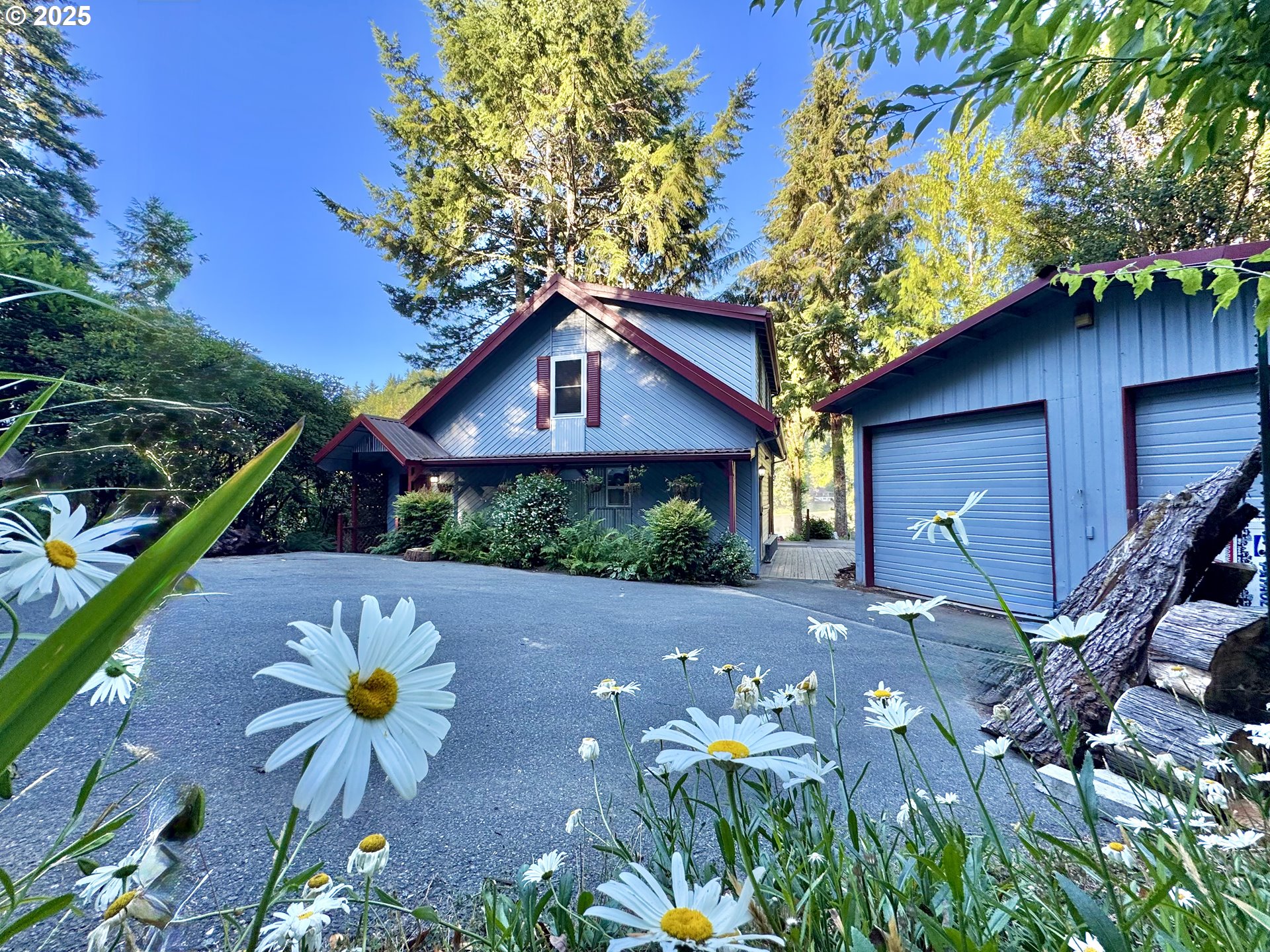 70700 Majestic Shores Road North Bend, OR 97459 - Photo 1 of 48 a front view of a house with a yard