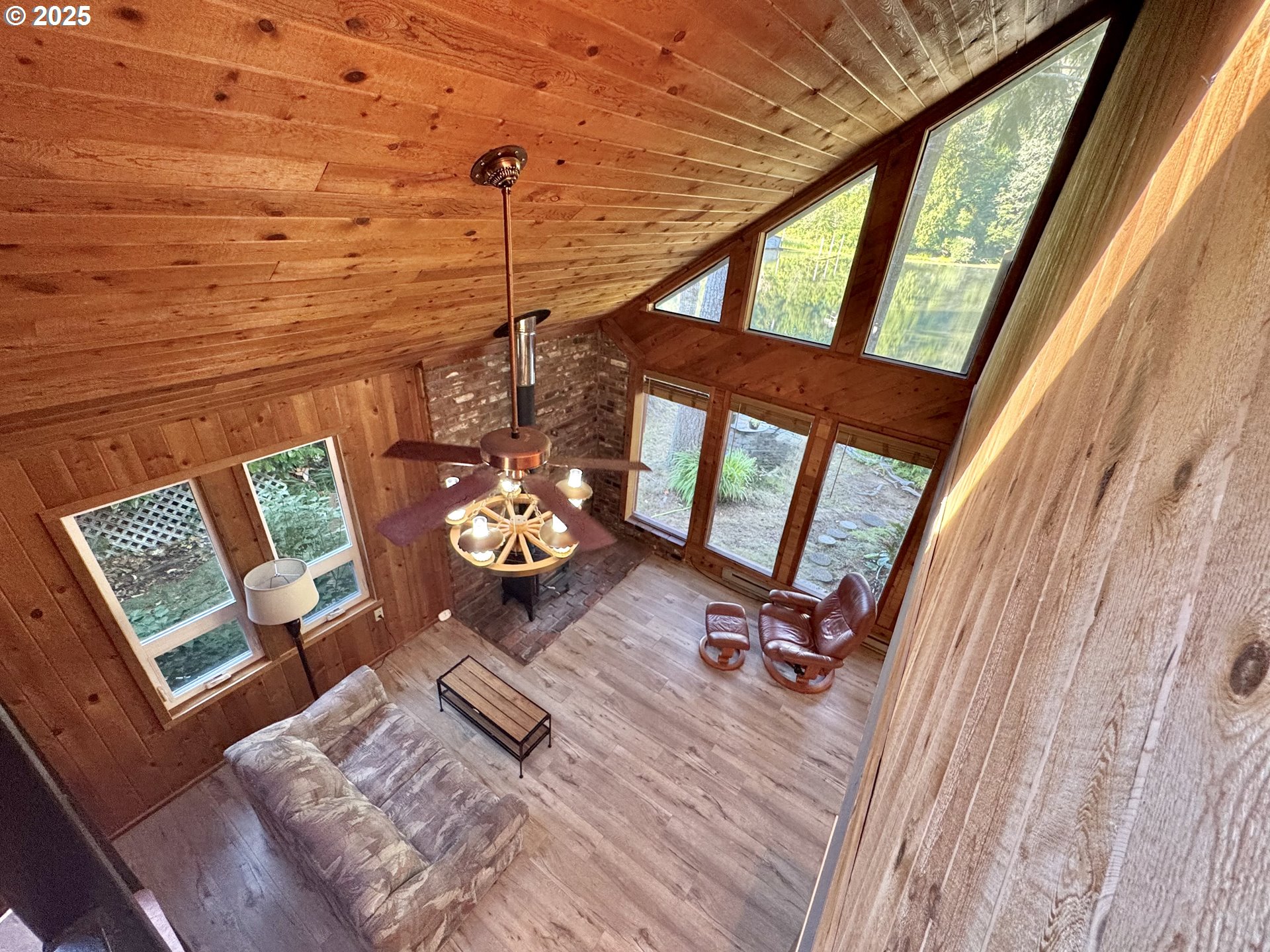 70700 Majestic Shores Road North Bend, OR 97459 - Photo 16 of 48 a view of a living room with furniture and floor to ceiling windows