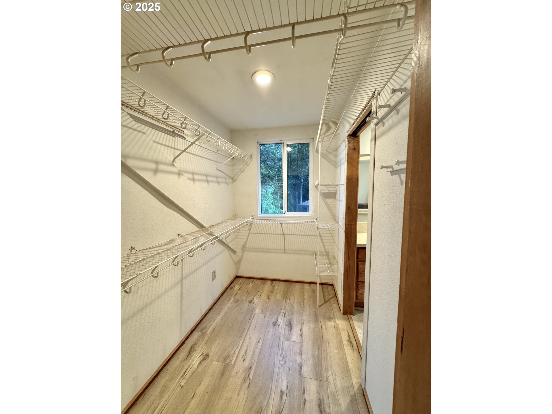 70700 Majestic Shores Road North Bend, OR 97459 - Photo 22 of 48 a view of a hallway with wooden floor and staircase