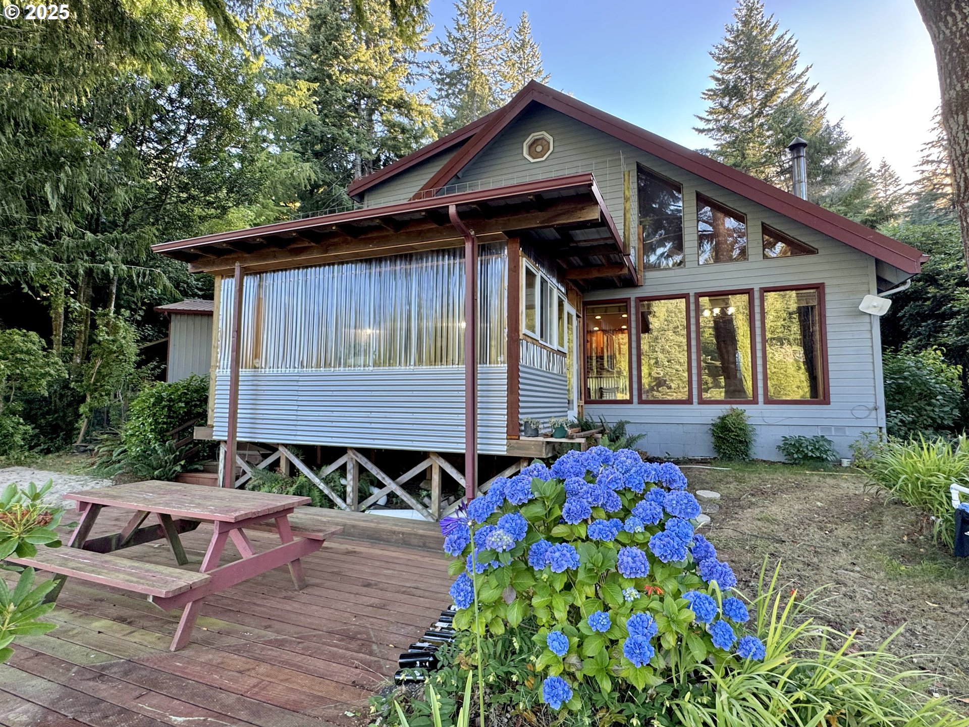 70700 Majestic Shores Road North Bend, OR 97459 - Photo 27 of 48 a front view of a house with garden