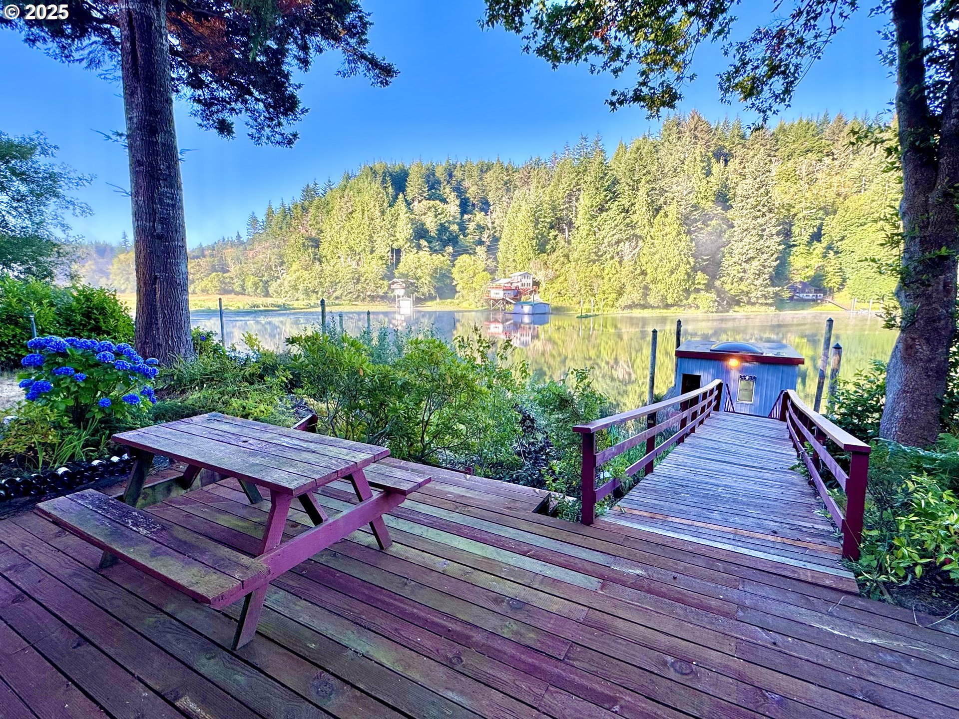 70700 Majestic Shores Road North Bend, OR 97459 - Photo 35 of 48 a view of a wooden deck with a bench