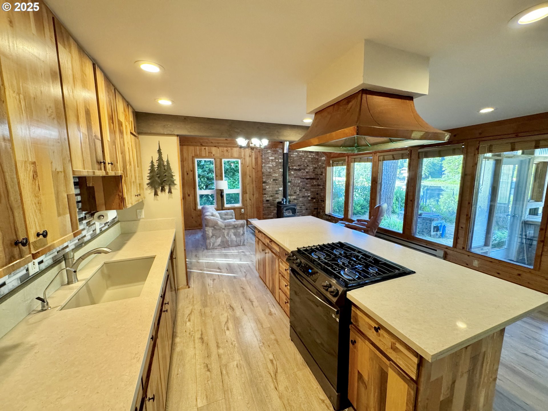 70700 Majestic Shores Road North Bend, OR 97459 - Photo 7 of 48 a kitchen with stainless steel appliances granite countertop a sink a stove and a refrigerator