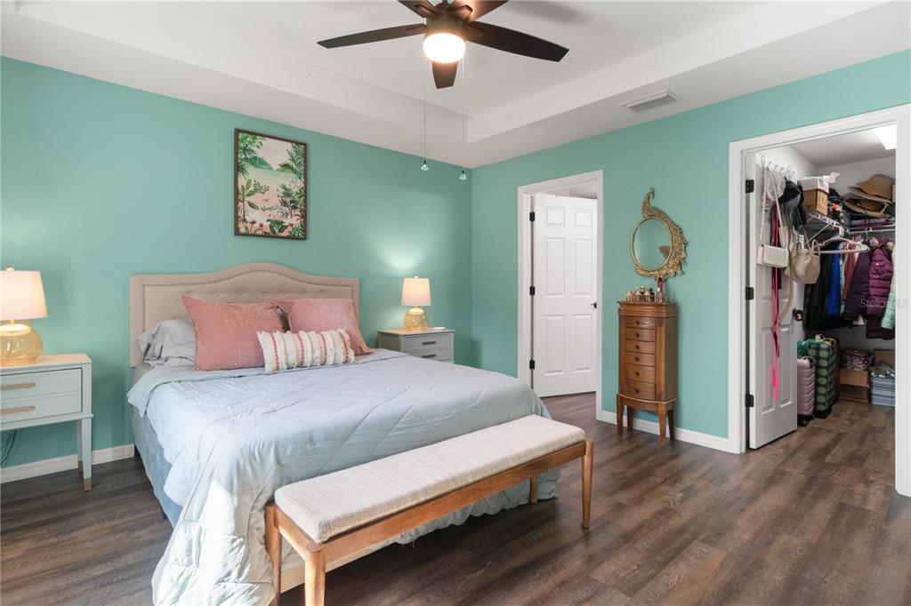 2545 Soundview Drive Dunnellon, FL 34431 - Photo 12 of 23 a bedroom with a bed and a chandelier