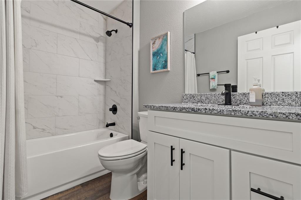 2545 Soundview Drive Dunnellon, FL 34431 - Photo 16 of 23 a bathroom with a granite countertop sink toilet and shower