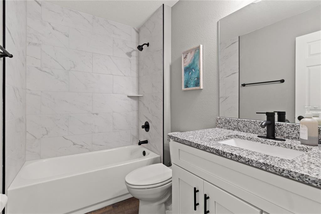 2545 Soundview Drive Dunnellon, FL 34431 - Photo 17 of 23 a bathroom with a granite countertop sink toilet and shower