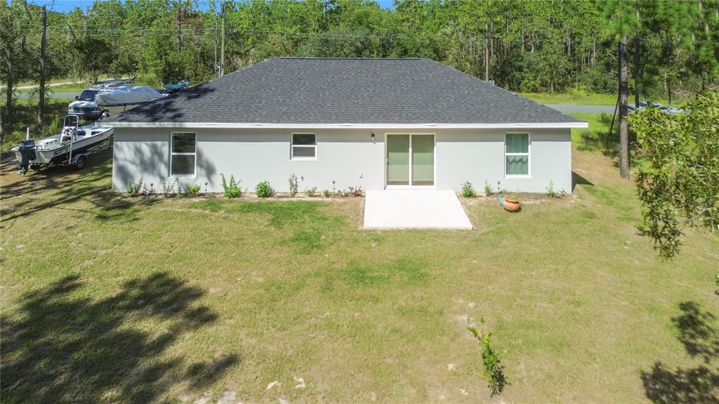 2545 Soundview Drive Dunnellon, FL 34431 - Photo 21 of 23 a view of a house with backyard and sitting area