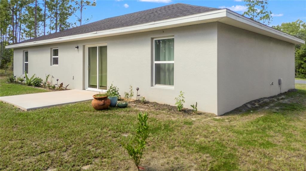 2545 Soundview Drive Dunnellon, FL 34431 - Photo 22 of 23 a view of a house with backyard and garden