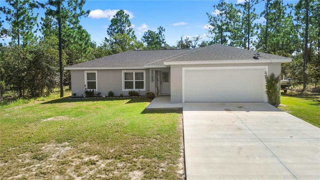 2545 Soundview Drive Dunnellon, FL 34431 - Photo 3 of 23 a view of a house with a yard and large tree