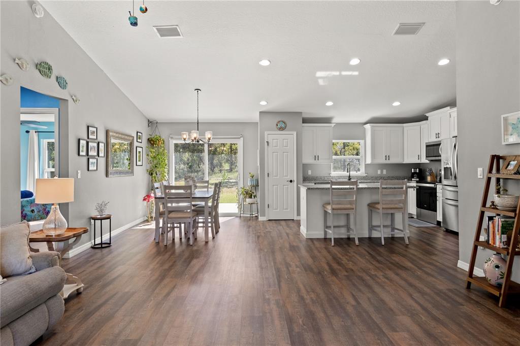 2545 Soundview Drive Dunnellon, FL 34431 - Photo 4 of 23 a kitchen with stainless steel appliances a dining table chairs stove refrigerator and cabinets