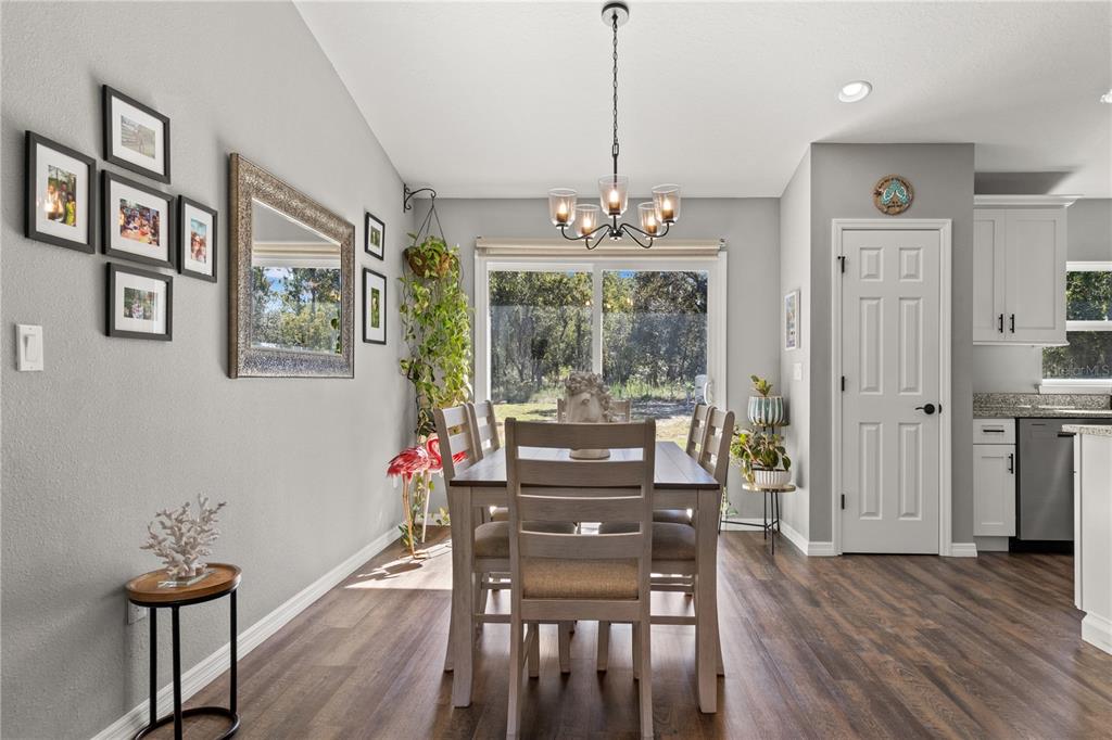 2545 Soundview Drive Dunnellon, FL 34431 - Photo 7 of 23 a view of a dining room with furniture window and wooden floor