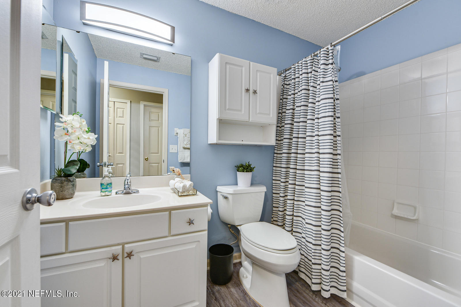 5434 Fort Caroline Road Jacksonville, FL 32277 - Photo 14 of 26 a bathroom with a sink toilet and shower