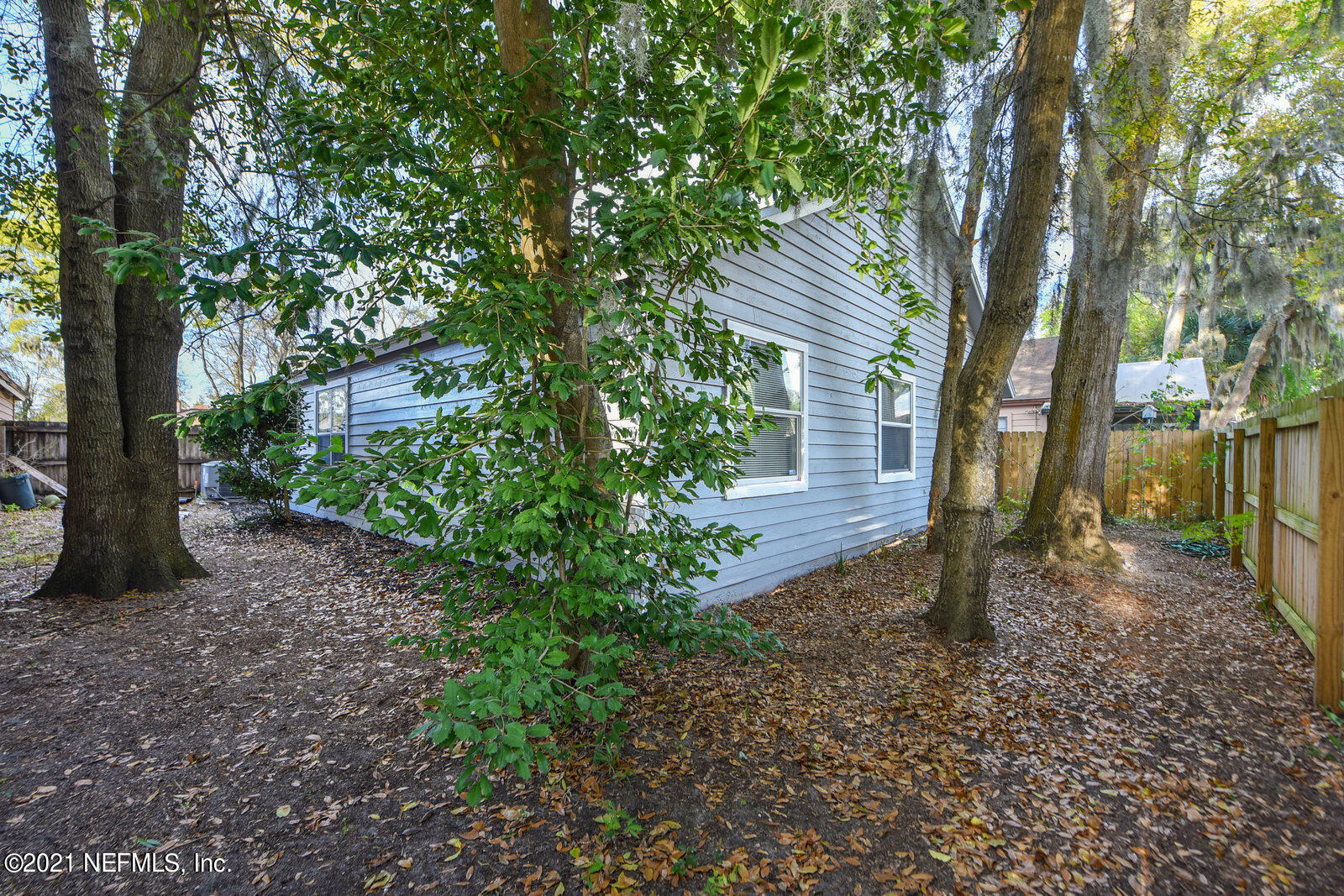 5434 Fort Caroline Road Jacksonville, FL 32277 - Photo 16 of 26 a backyard of a house with lots of green space