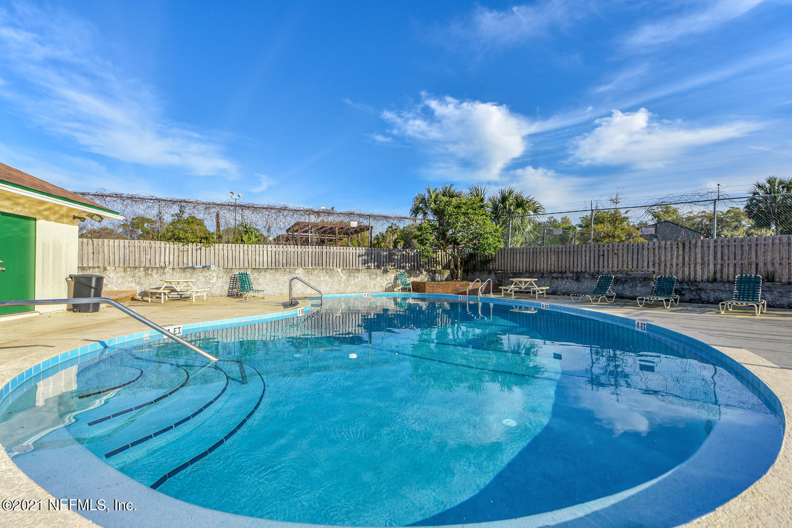 5434 Fort Caroline Road Jacksonville, FL 32277 - Photo 18 of 26 a view of a swimming pool with an outdoor seating