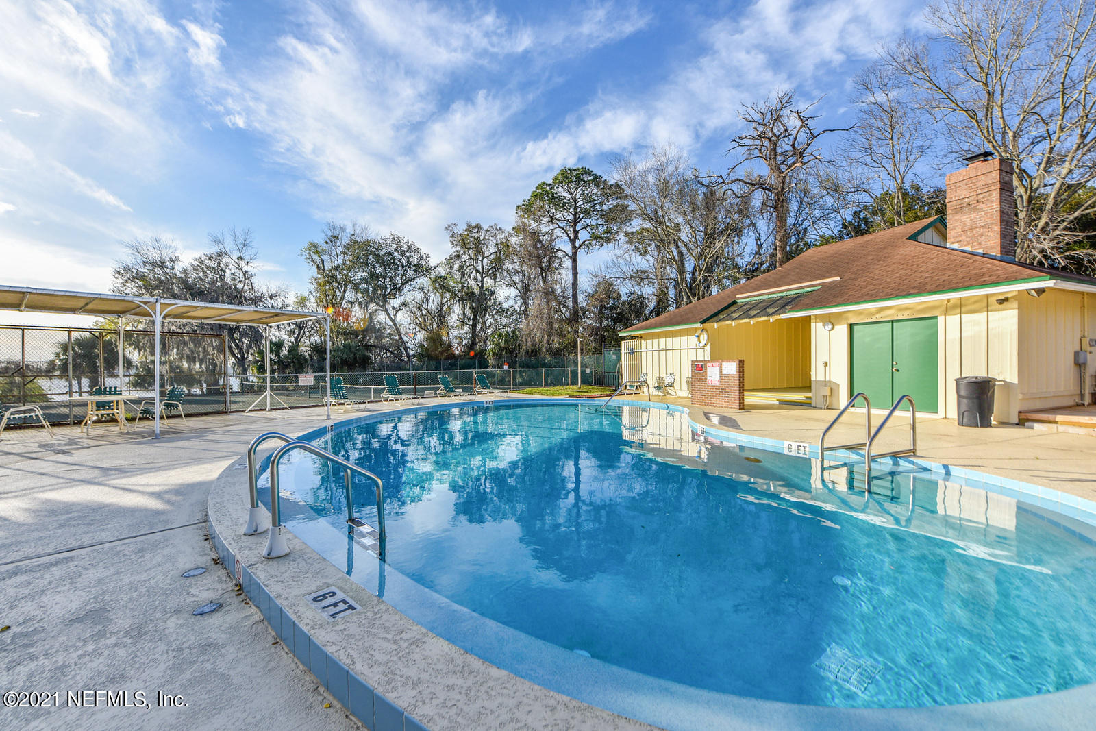 5434 Fort Caroline Road Jacksonville, FL 32277 - Photo 19 of 26 a view of swimming pool with lounge chair and dinning table under an umbrella